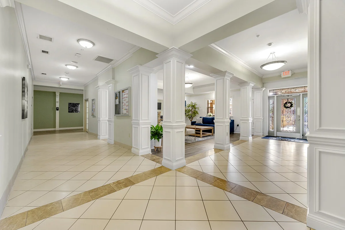 a large hall with white columns