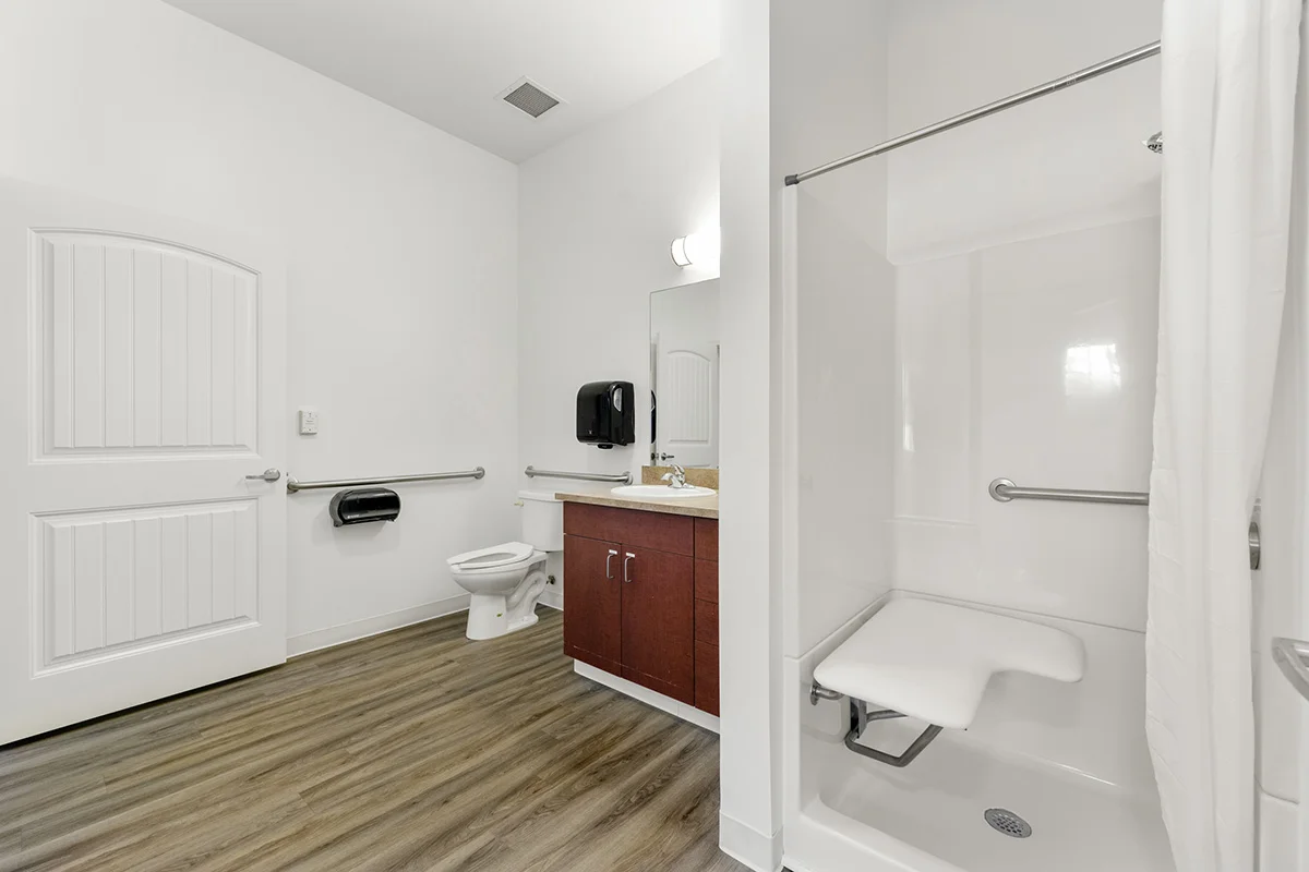 a bathroom with a shower and toilet