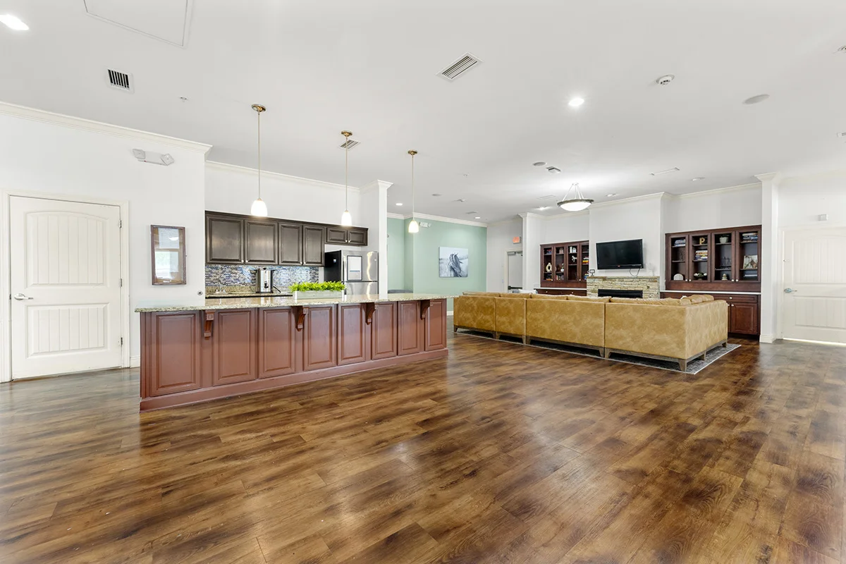 a large room with a wood floor and a wood floor