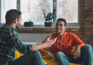 a man meets with his therapist in alcohol addiction treatment 