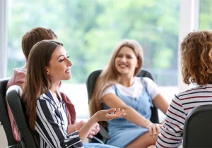 a prescription drug addiction therapy group meets for a session