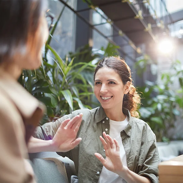 a woman talking to another woman