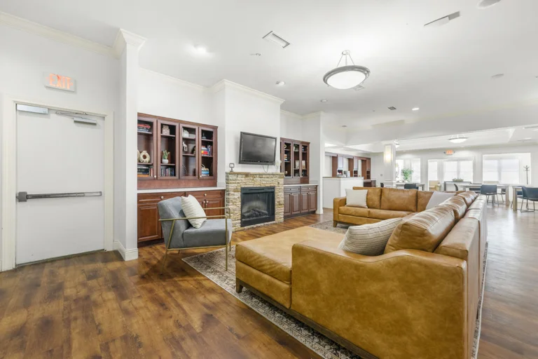 a living room with a fireplace and couches