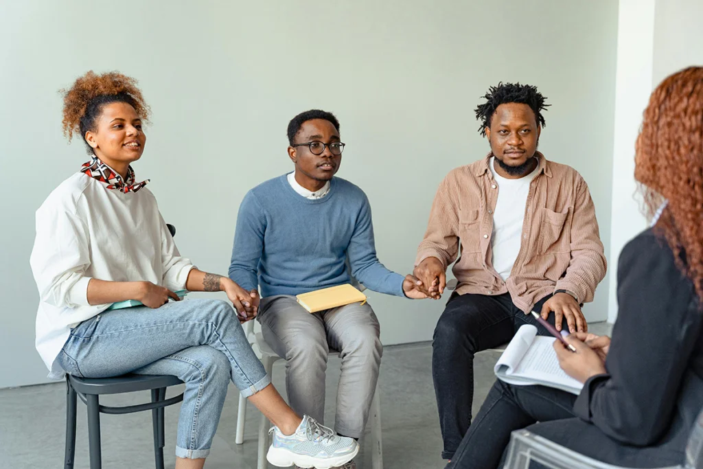 a group of people sitting in a circle
