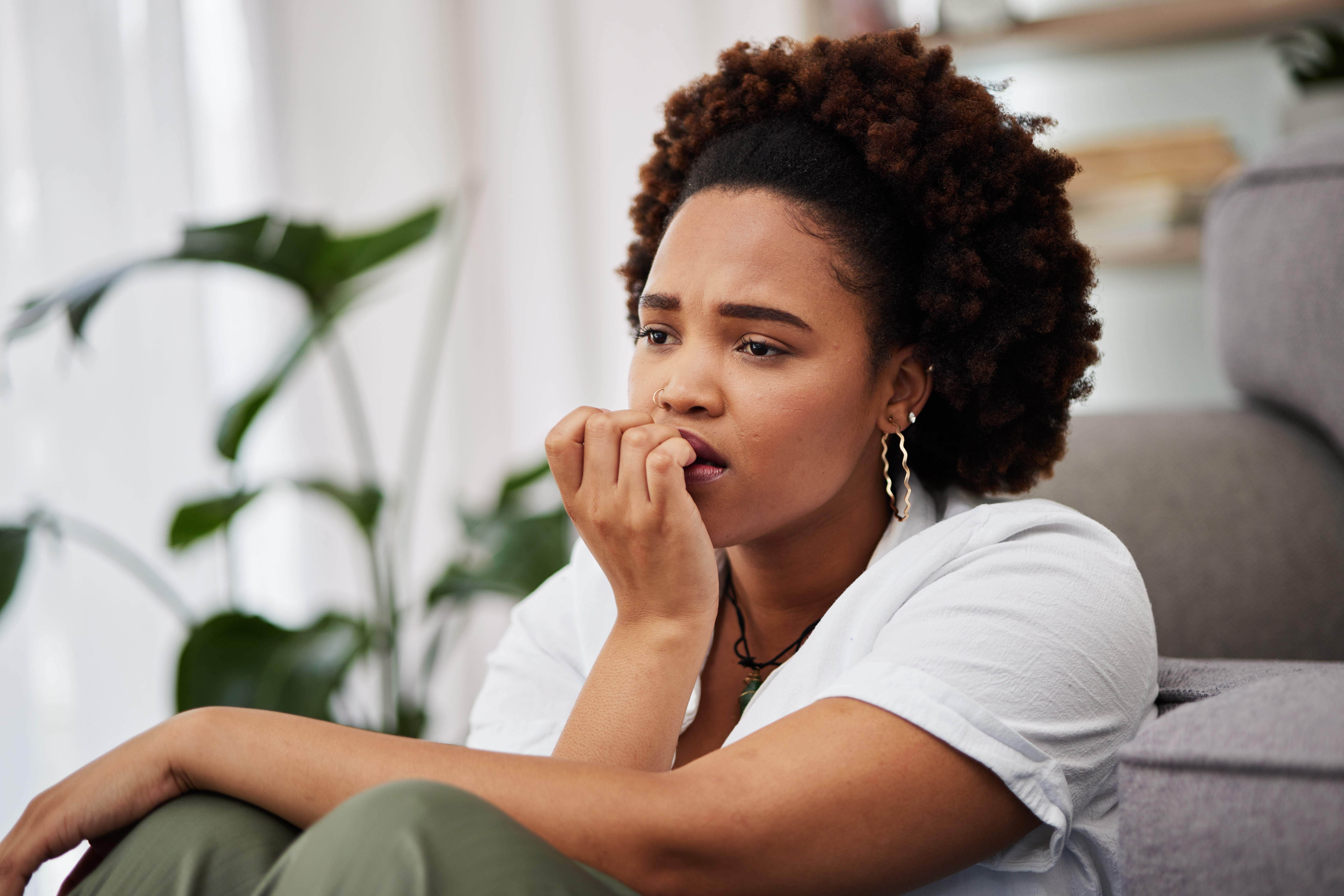 distressed woman bits her fingernails thinking about the effects of benzos on the brain