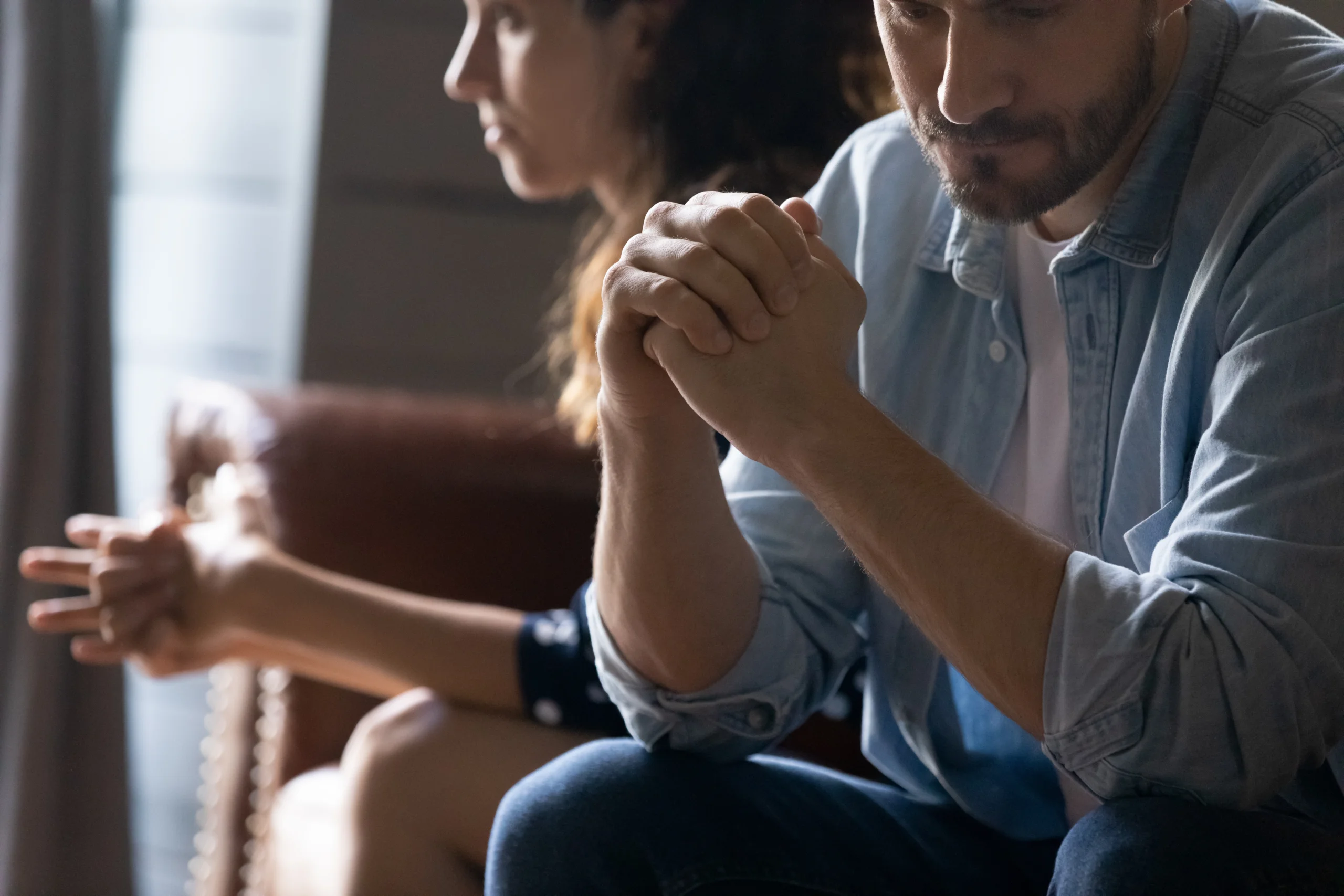 Couple in deep conversation, tense atmosphere while talking about porn addiction